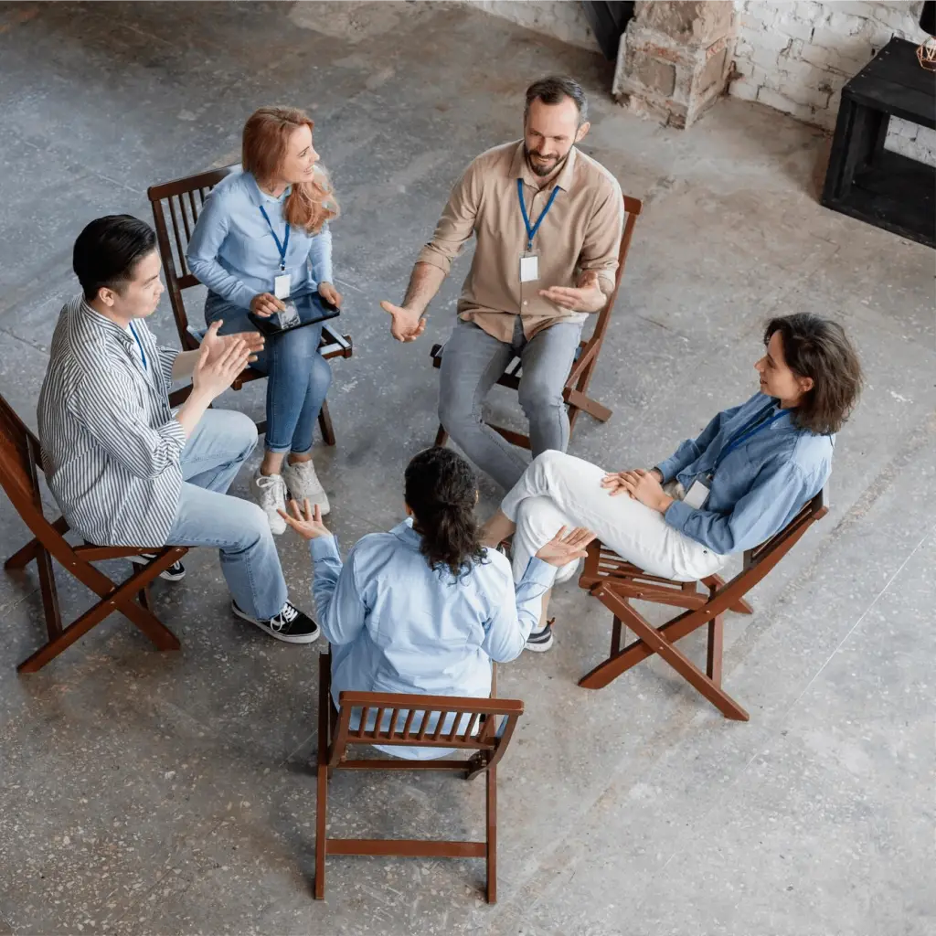 People at work sitting in a circle for a workplace training